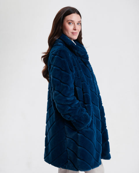 Nikki Jones Reversible faux fur coat with diagonal jacquard stitch
