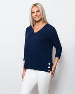 Snoskins Seersucker Knit V-Neck Body skimming with button detail at hip Matching thread Style 77585-24S